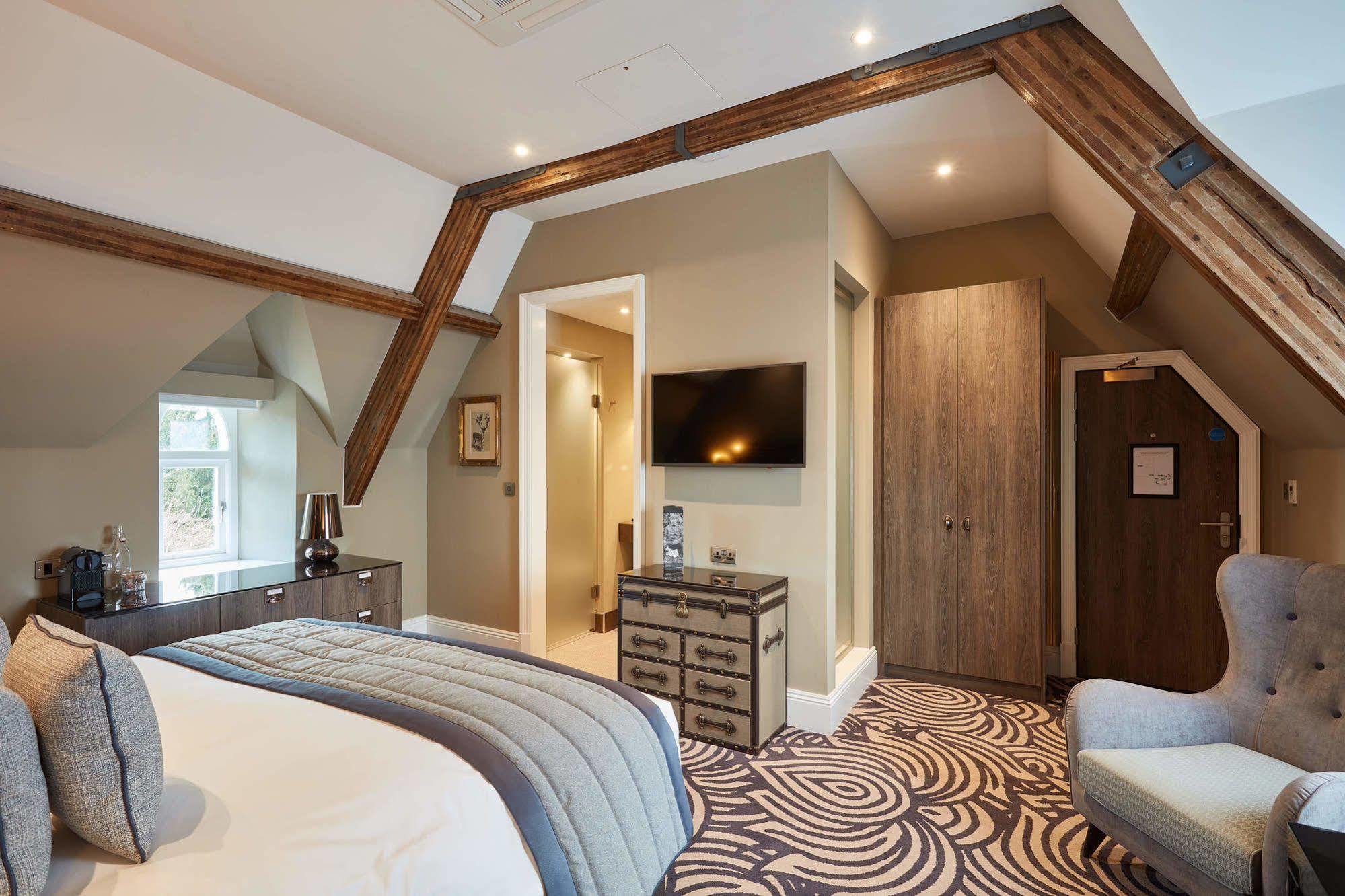 ホテル オッドフェローズ オン ザ パーク チードル エクステリア 写真 A bedroom at The Old Bank Hotel
